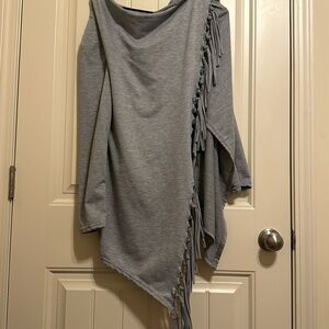 Cute boutique sweater with fringe! Light weight and very cozy! Never worn